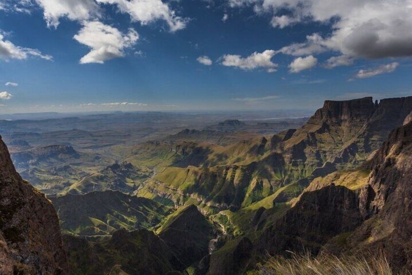 A mountainous landscape with deep valleys and rugged terrain. 2