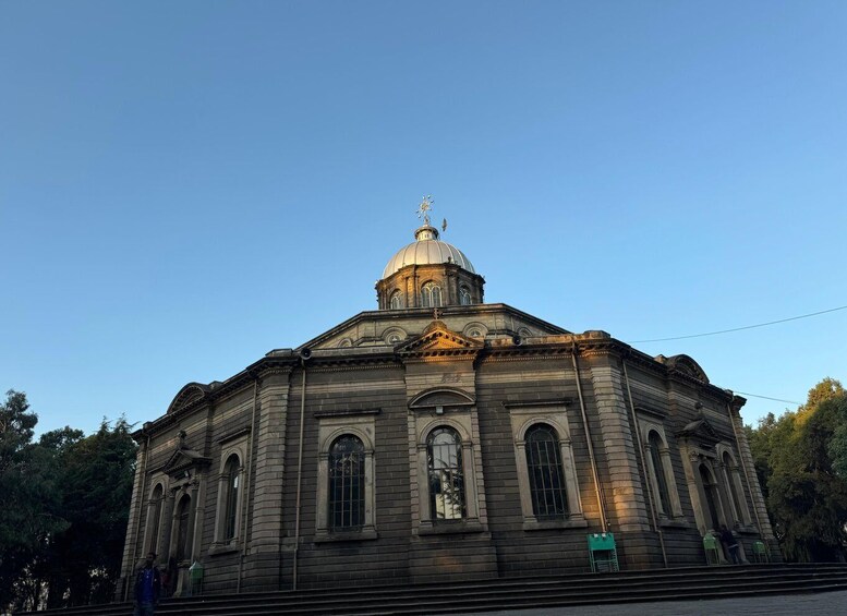 A large, historic building with a prominent dome and arched windows. 3