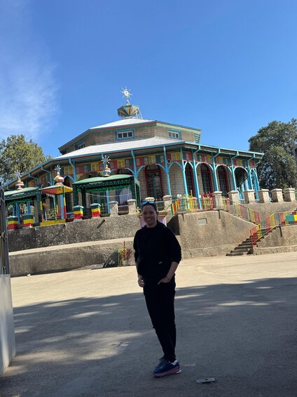 A colorful building with a dome and a clock tower. 4