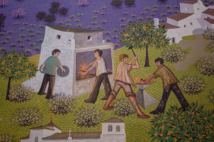 A mosaic with people, a building, and trees. 5