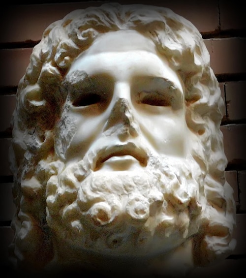 A sculpture with a textured surface and a rough, uneven texture. 2