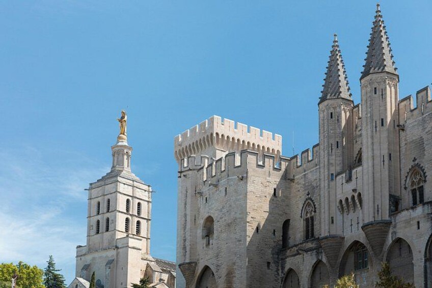 A historic castle with a prominent tower and two spires. 2