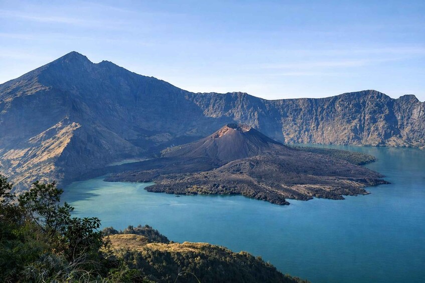 A mountainous landscape with a lake and a volcano. 1