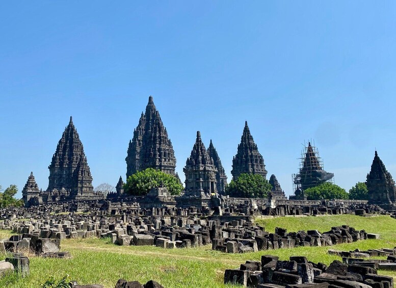 Ancient temple ruins with multiple structures and scattered stone blocks. 3