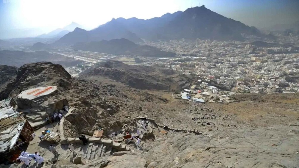 A mountainous landscape with a city in the valley below. 4