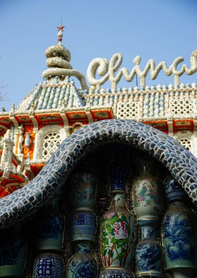A traditional Chinese building with ornate decorations and a sign that reads 'China.' 1