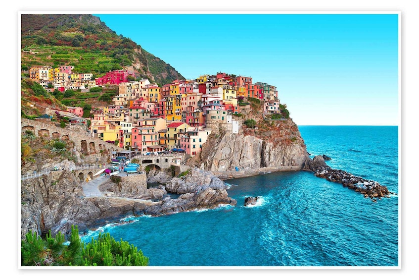 A coastal village with colorful buildings perched on a cliff overlooking the sea. 3
