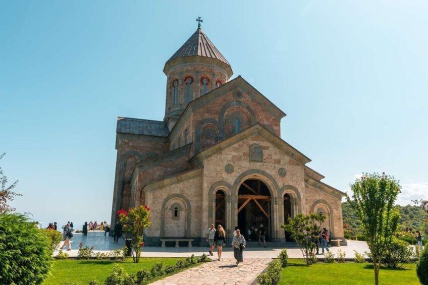 A historic church with a prominent bell tower and arched windows. 4