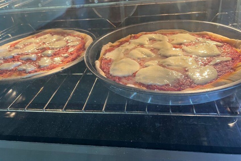 Two pizzas in an oven. 2