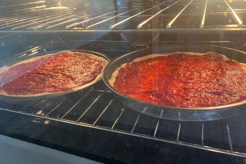 Two pizzas in an oven. 5
