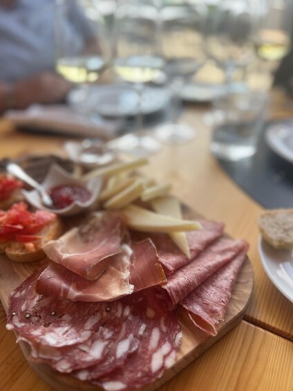 A charcuterie board with various meats and cheeses. 4