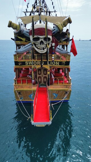 A boat named 'Sword Lion' with a red slide and a skull decoration. 2