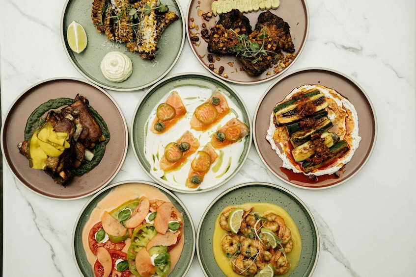 A variety of plated dishes with different garnishes and sauces. 1