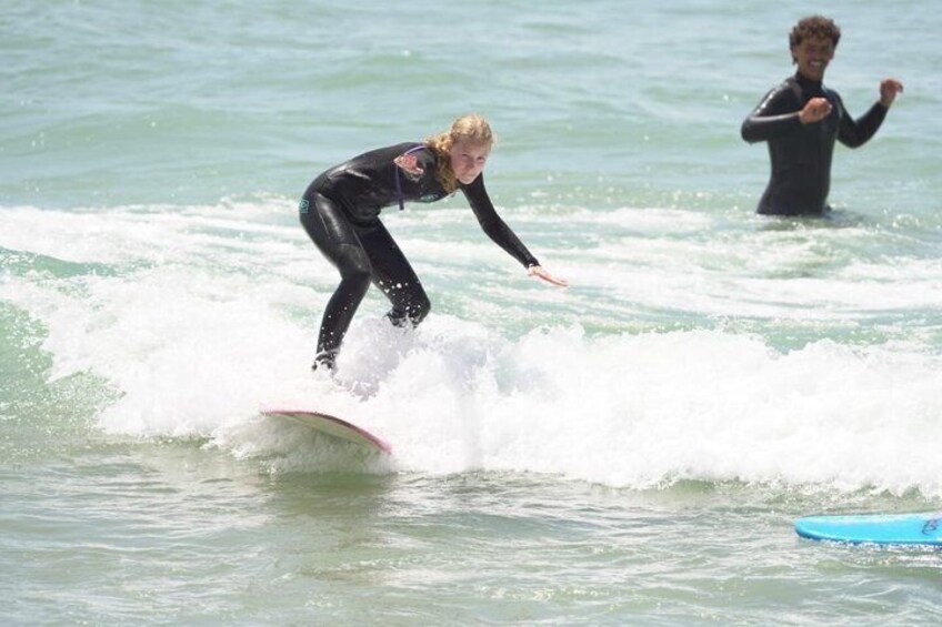 A person surfing on a wave in the ocean. 3