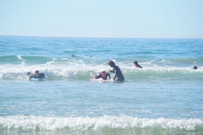 People surfing in the ocean. 3