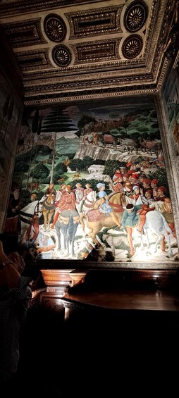 A detailed fresco mural on a ceiling, depicting a historical scene with figures and animals. 5