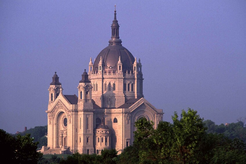 A large, historic cathedral with a prominent dome and multiple towers. 1