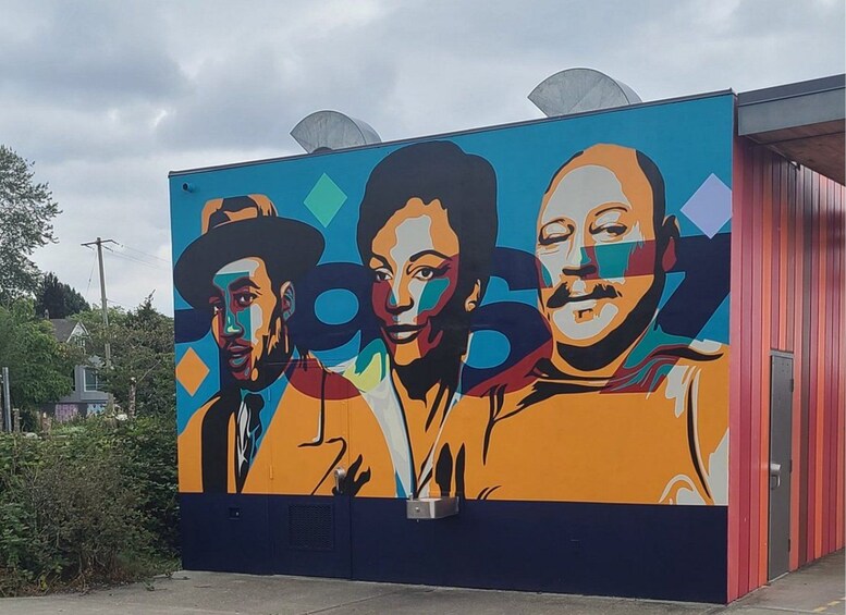 A colorful mural with abstract geometric shapes and figures. 4