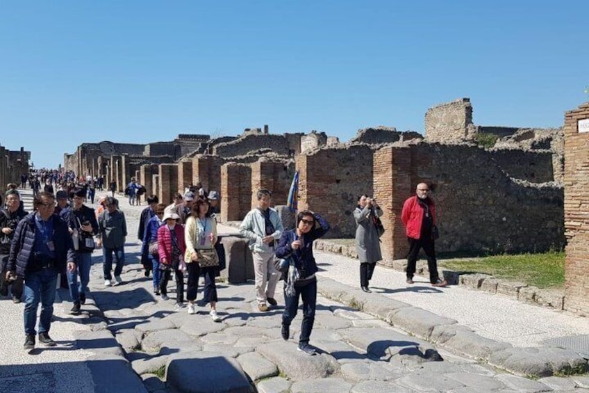 A historical site with stone pathways and ancient ruins. 4