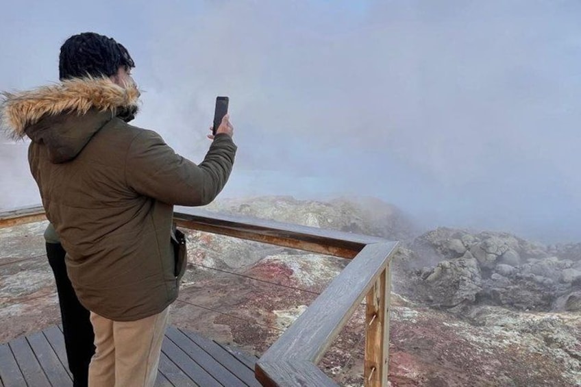A person taking a photo with a smartphone. 2