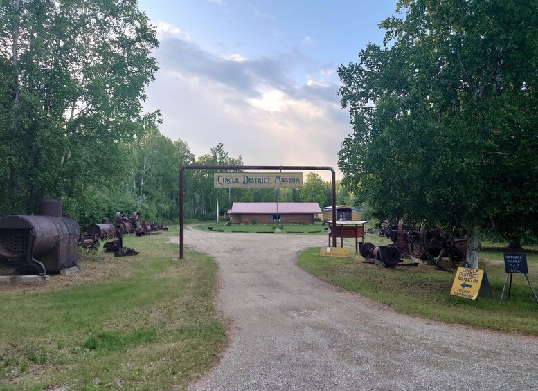 A rural entrance to the Circle District Museum with vintage machinery on display. 3
