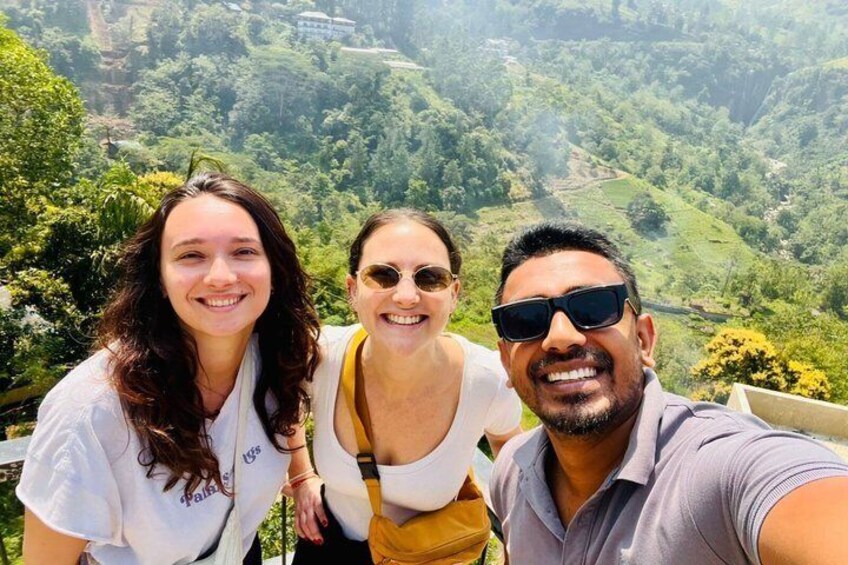 Three people taking a selfie with a mountainous landscape in the background. 5