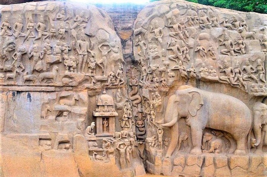 A detailed stone carving with figures, including an elephant and a human figure. 1