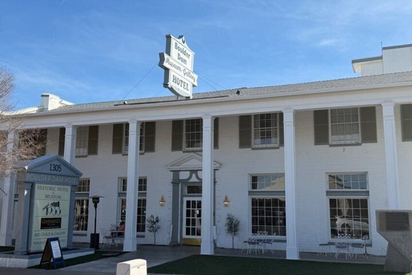 A historic hotel with a sign for the Boulder Dam Museum-Gallery Hotel. 2