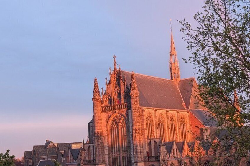 A Gothic-style church with a prominent spire and detailed stonework. 1