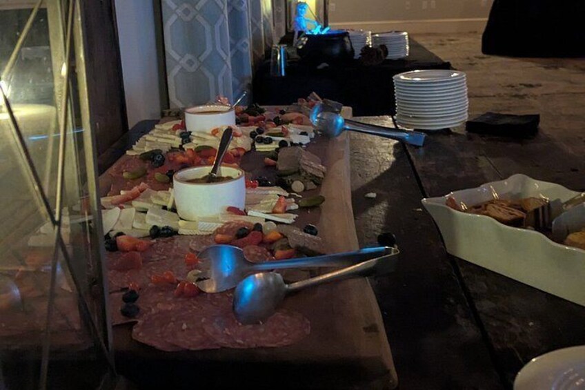 A buffet with various food items and utensils. 5
