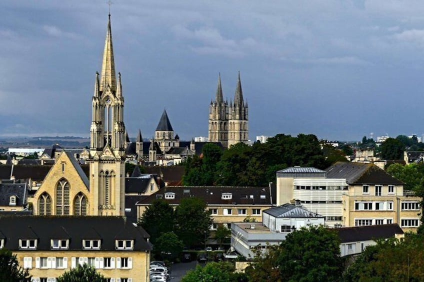 A cityscape with a prominent church spire, a cathedral, and residential buildings. 4