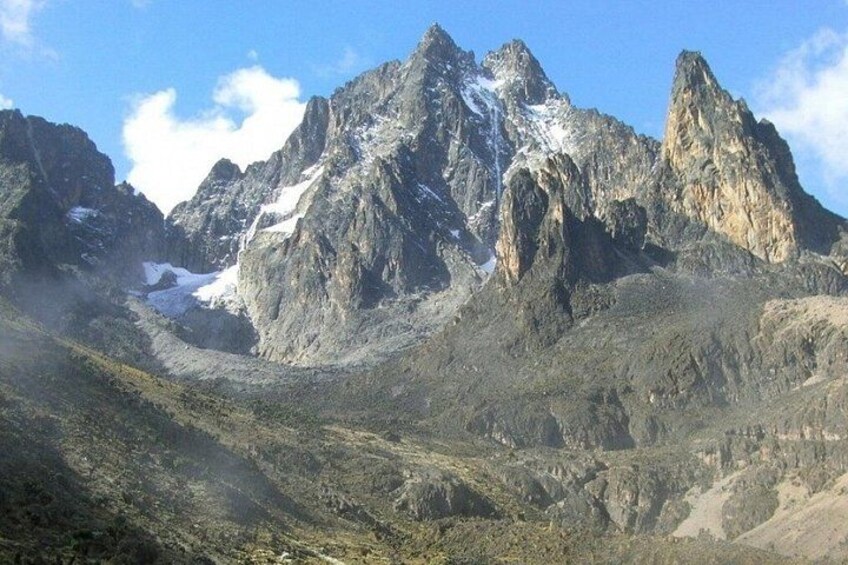 A rugged mountain range with sharp peaks and a valley. 4