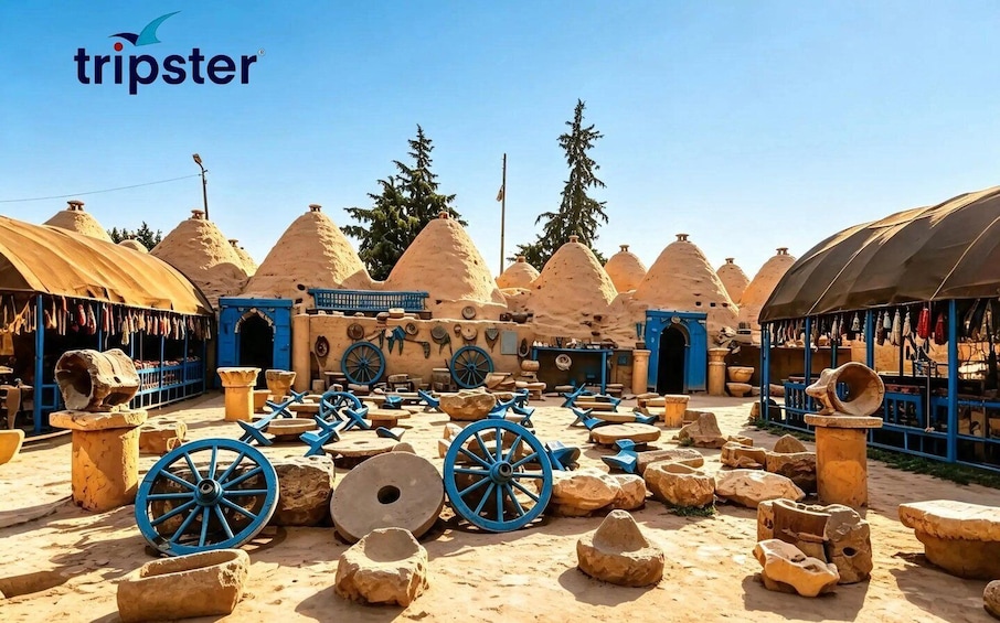 A traditional village with mud-brick structures, blue wheels, and pottery. 3