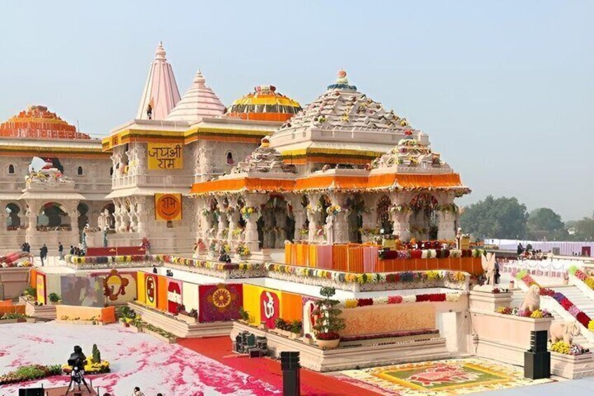 A temple with multiple domes, intricate carvings, and a red carpet. 4
