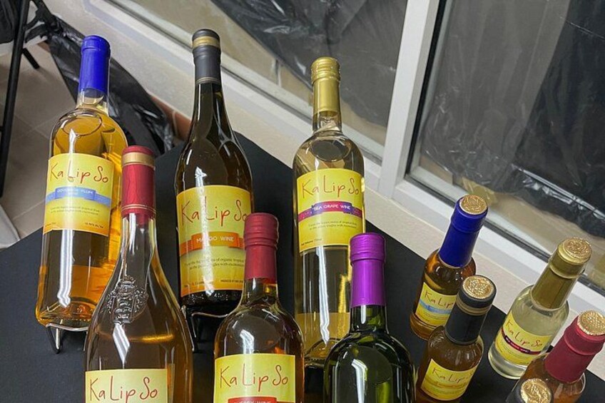 Several bottles of Kalipso wine with labels, arranged on a table. 2