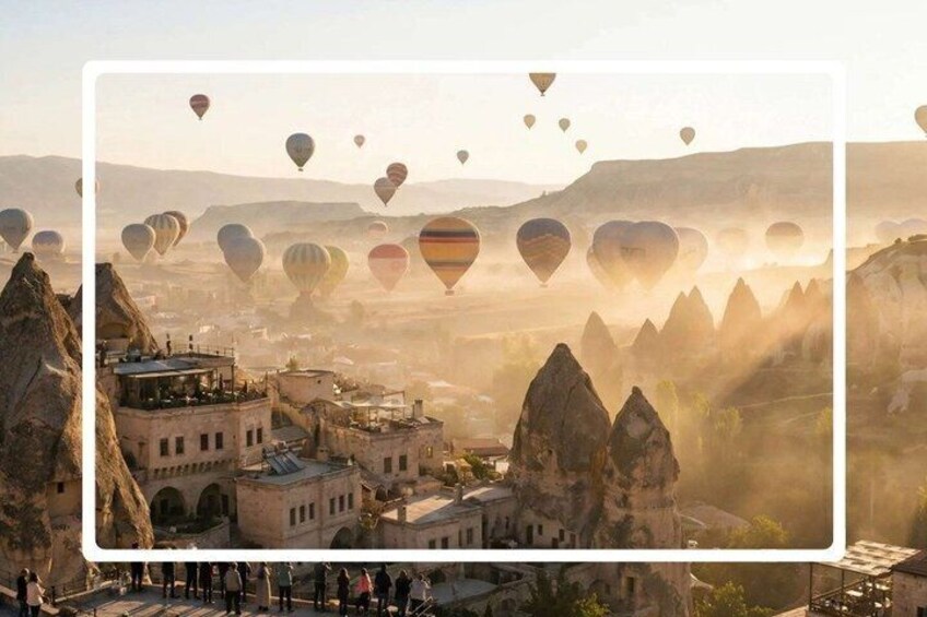 A mountainous landscape with unique rock formations and a town with traditional architecture. 3