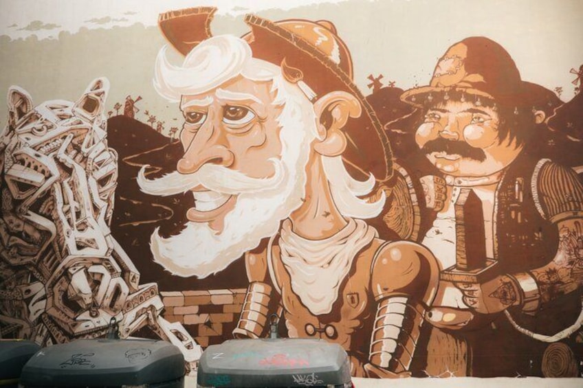 A mural with a figure in armor and a figure with a mustache. 3