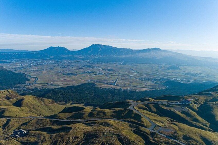 A mountainous landscape with winding roads and a river. 3