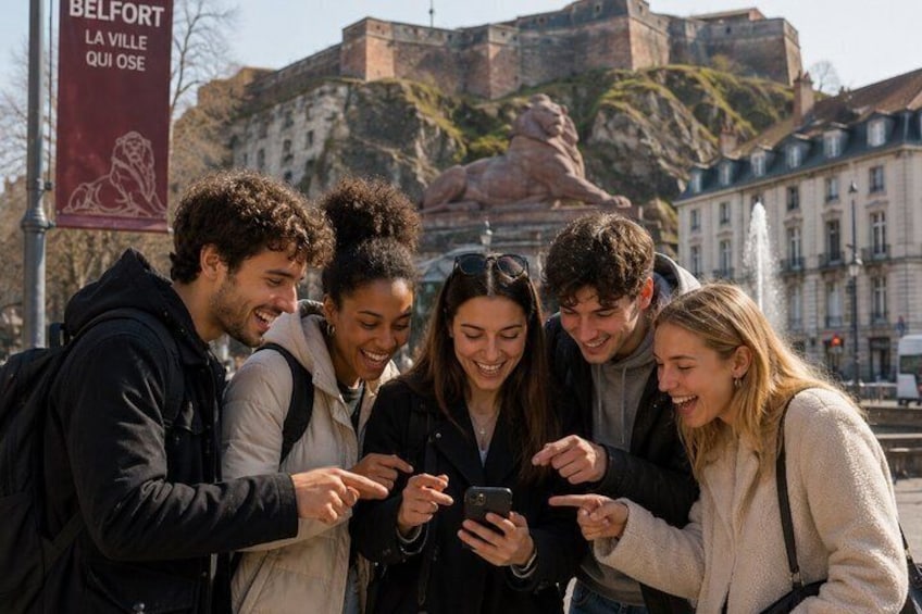 A group of people looking at a smartphone, with a historical monument and a banner in the background. 2