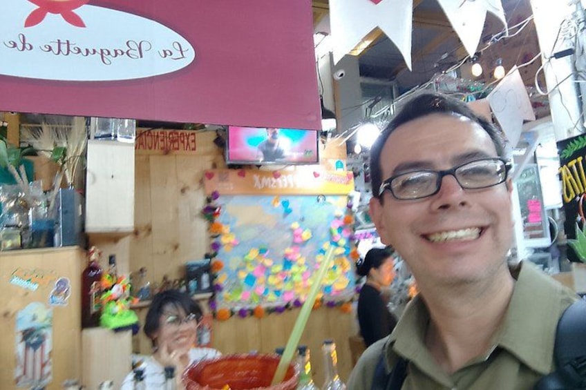 A person in a store with various items on display, including a sign that says 'EXPERIMENTAL.' 2
