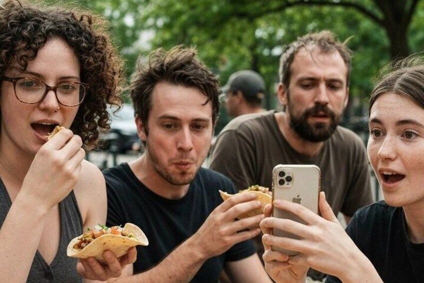 People eating tacos and using smartphones outdoors. 4