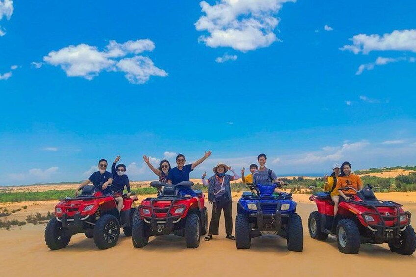 A group of people on ATVs in a desert landscape with clear skies. 2