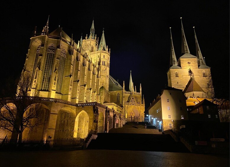 A Gothic cathedral with multiple spires and a bridge in the foreground. 1