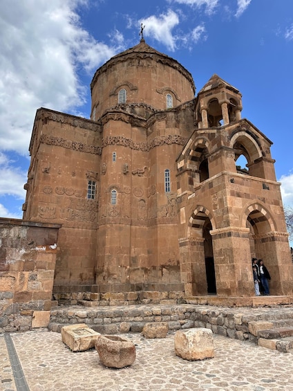 A historic building with a dome and arched entrance. 3