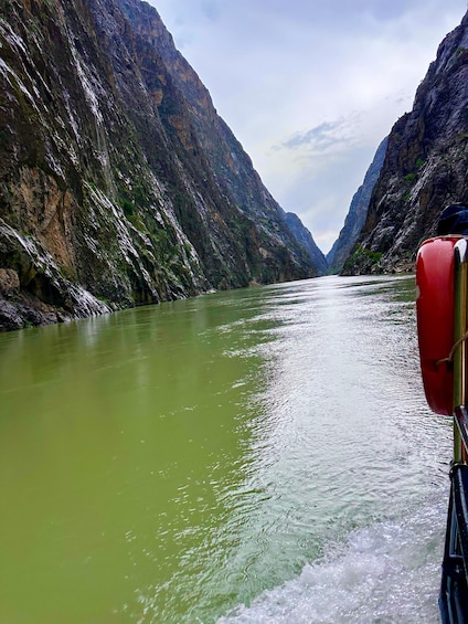 A river flowing through a canyon with steep cliffs on either side. 5