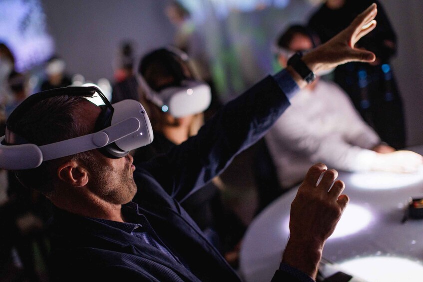 A person wearing a virtual reality headset. 2