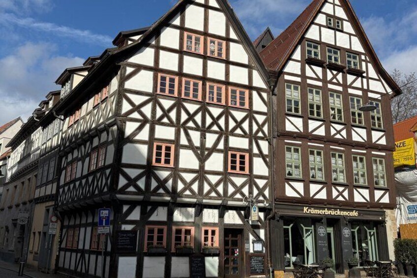 A traditional half-timbered building with a sign reading 'Kramerbrückencafé.' 5