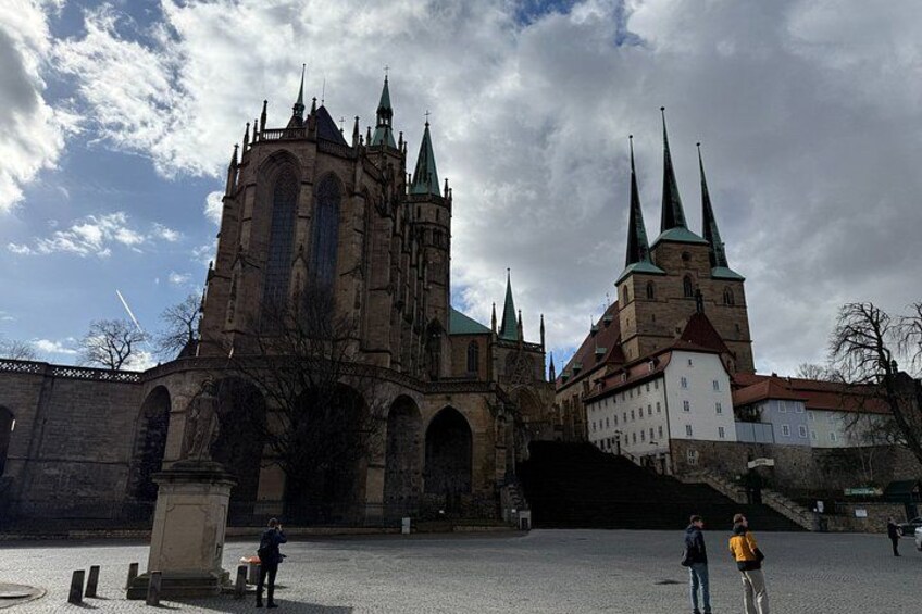 A historic church with multiple spires and a large central tower. 5