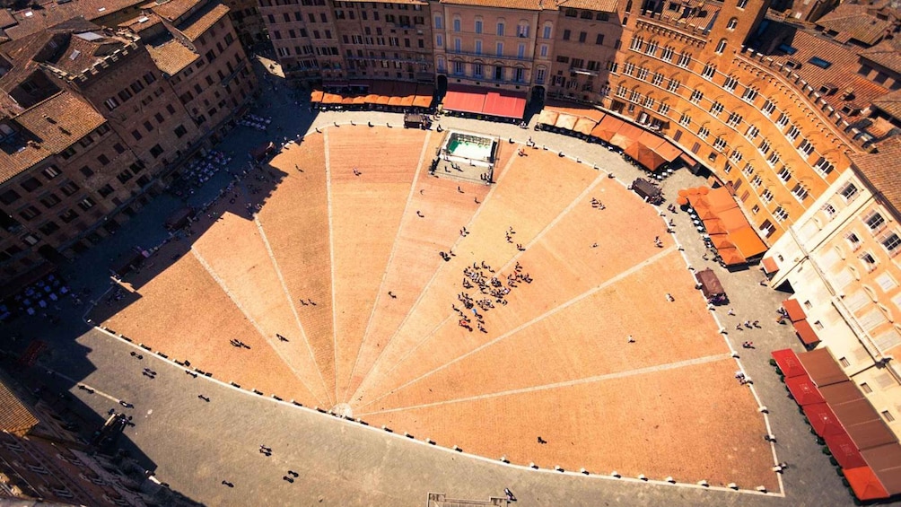 An aerial view of a large open plaza surrounded by historic buildings. 1