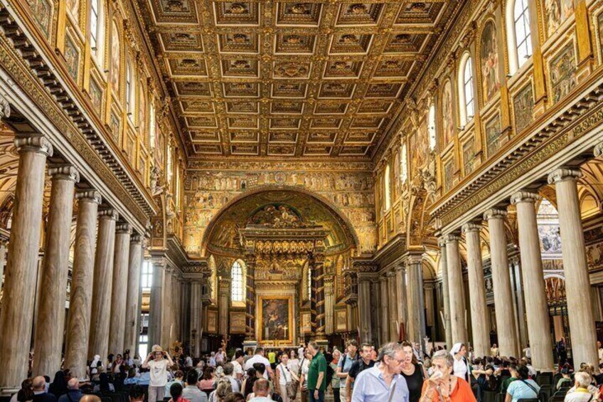 An ornate hall with high ceilings, columns, and intricate ceiling artwork. 5